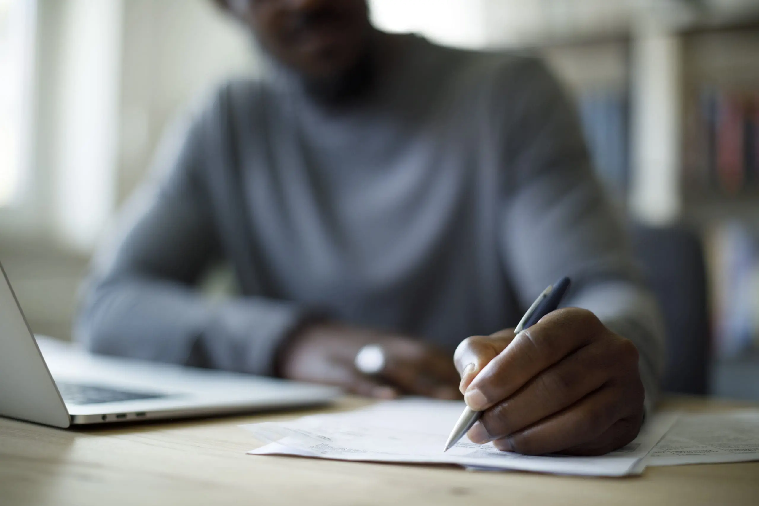 Man filling out paperwork